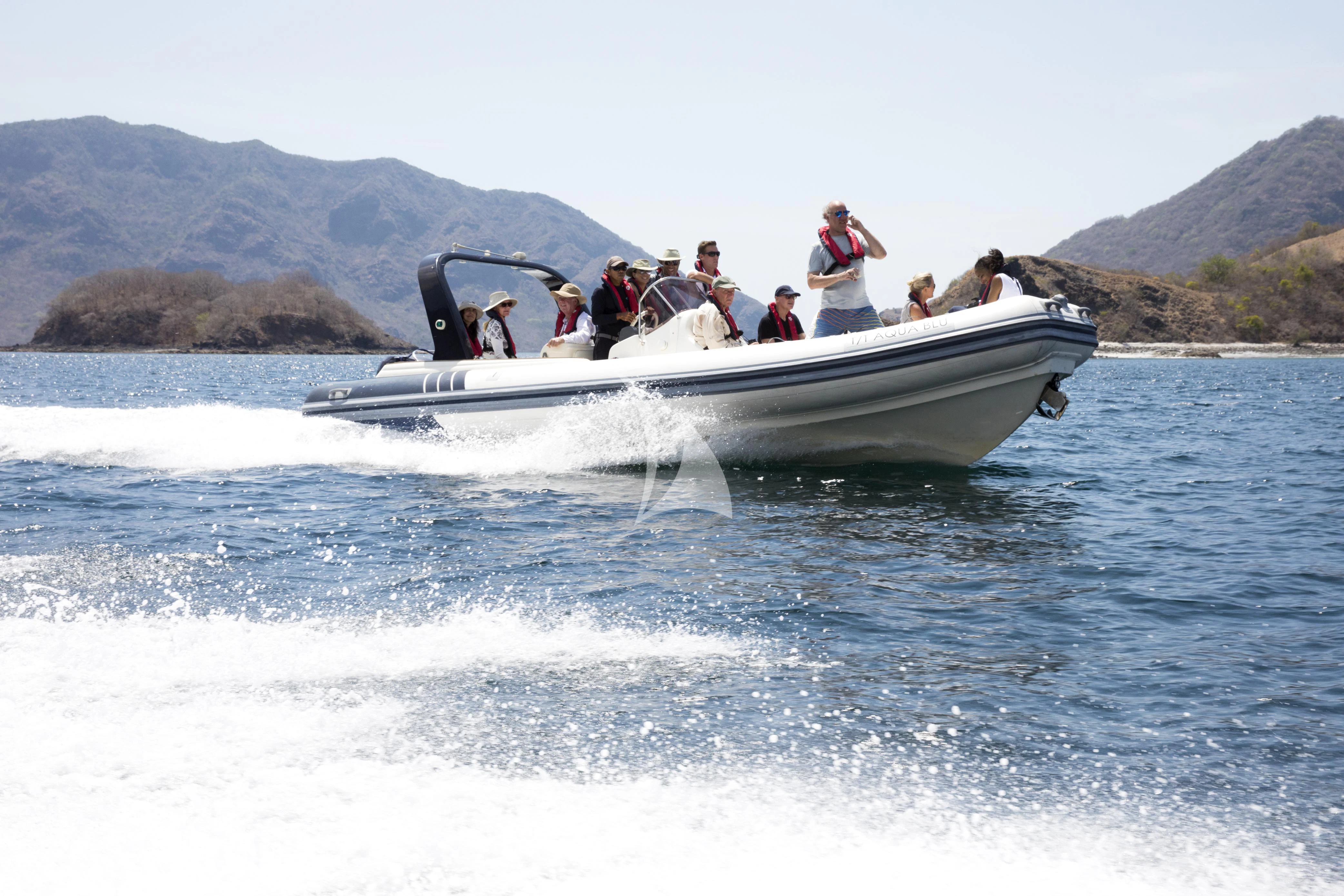 a group of people on a boat aboard AQUA BLU Yacht for Sale