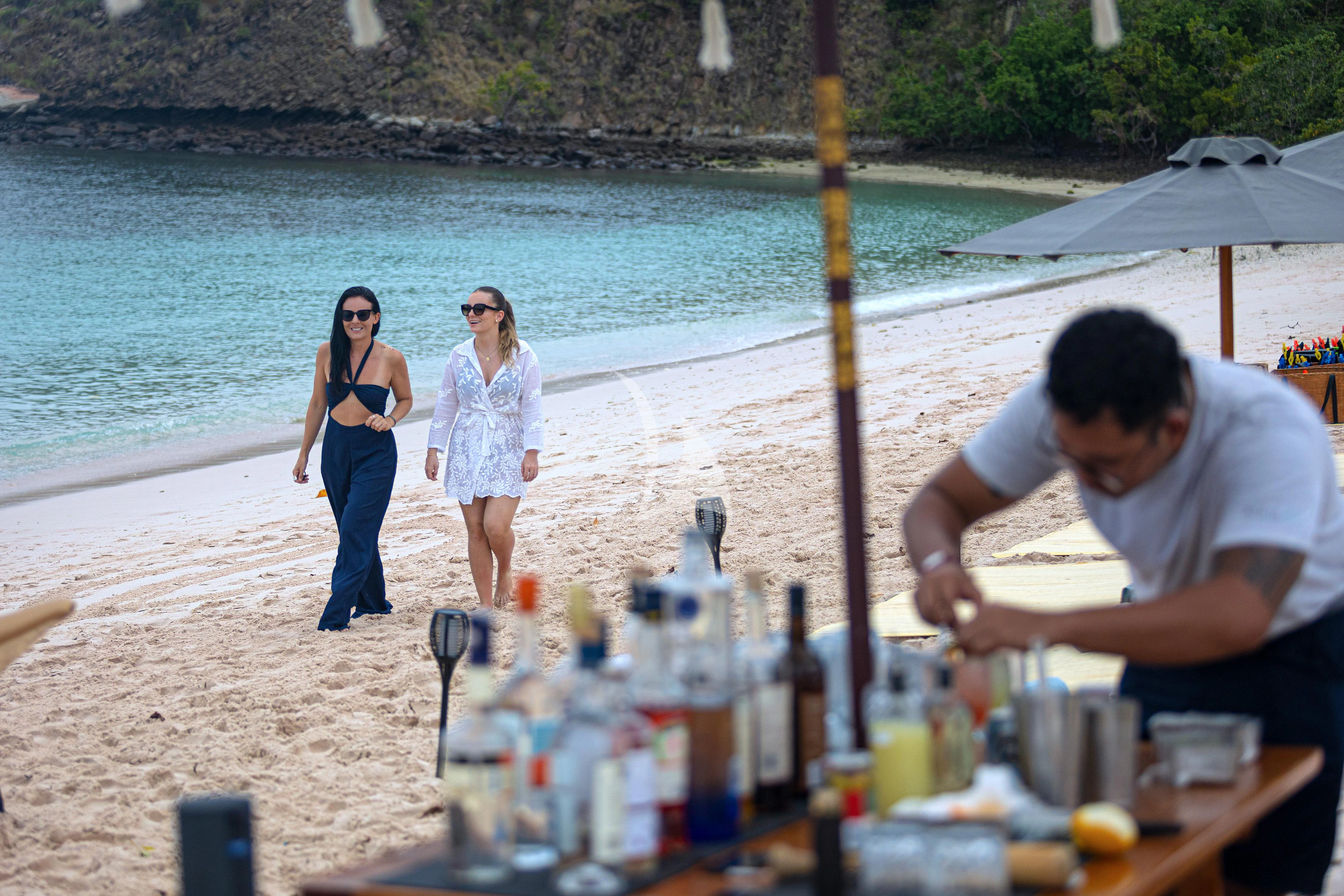 a group of people at a bar aboard AQUA BLU Yacht for Sale
