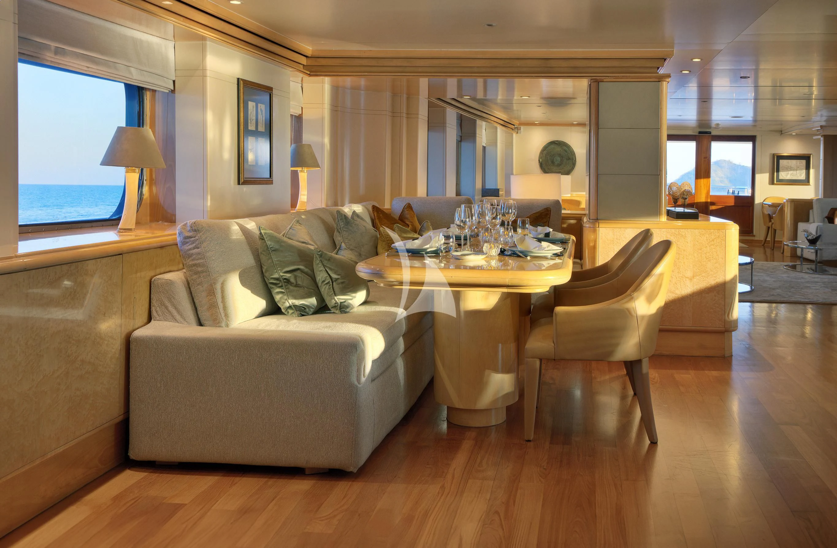 a living room with a couch and a table aboard AQUA BLU Yacht for Sale