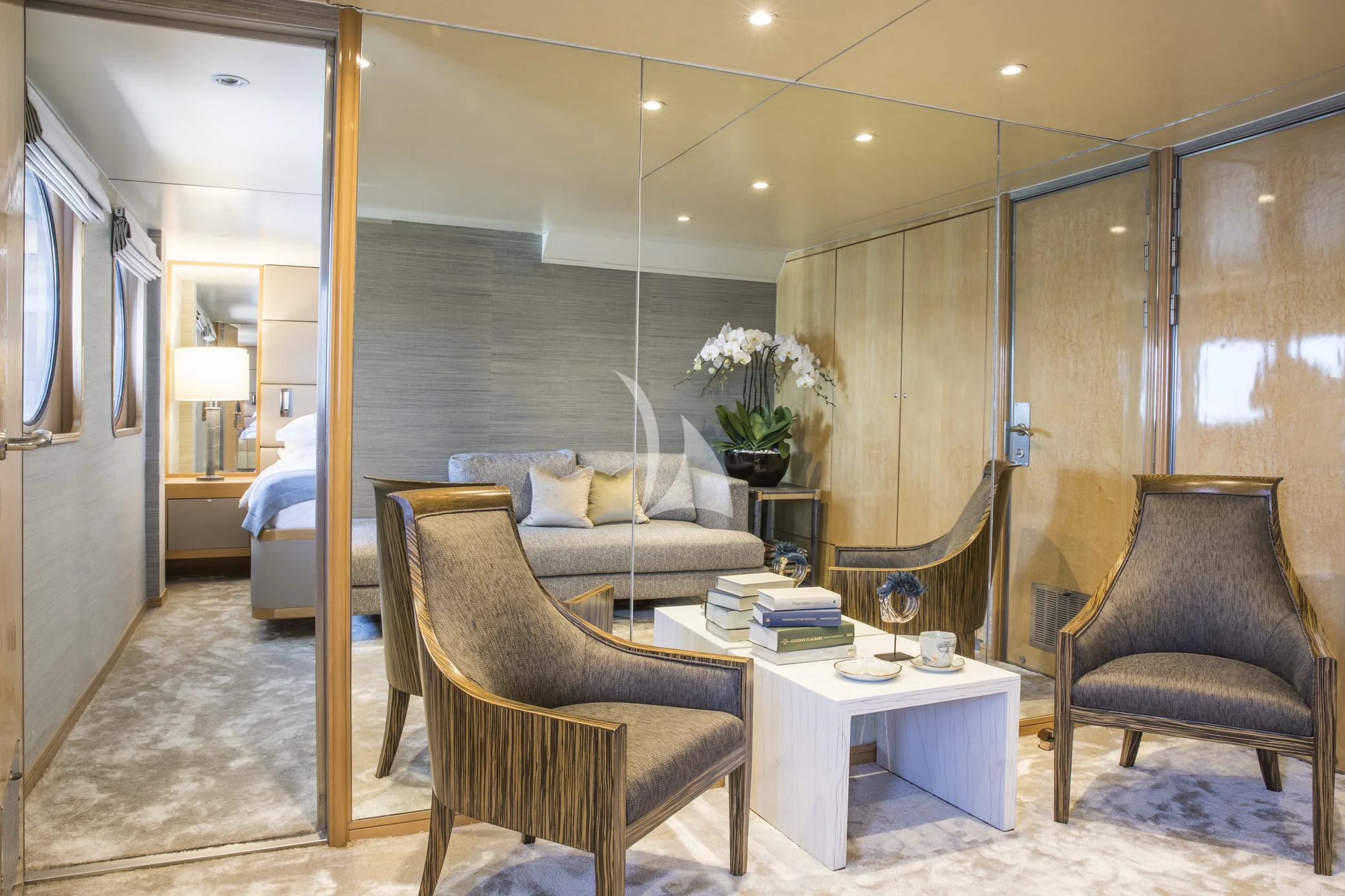 a room with a couch and a table and a chair aboard AQUA BLU Yacht for Sale