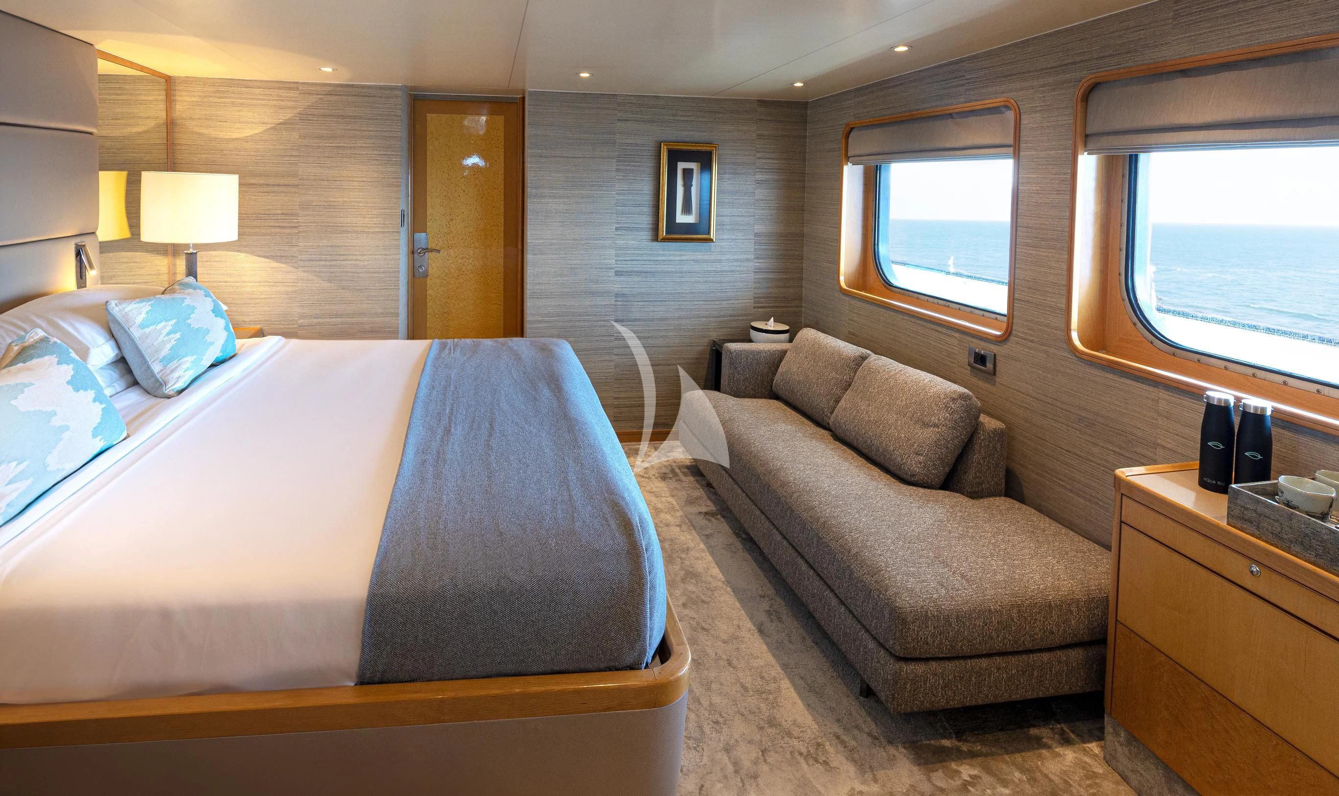 a room with a bed and a couch aboard AQUA BLU Yacht for Sale