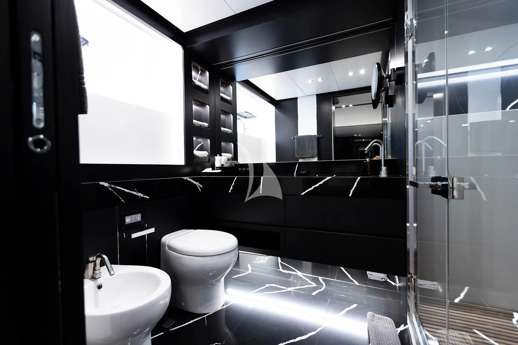 a bathroom with a glass shower aboard R23 Yacht for Charter