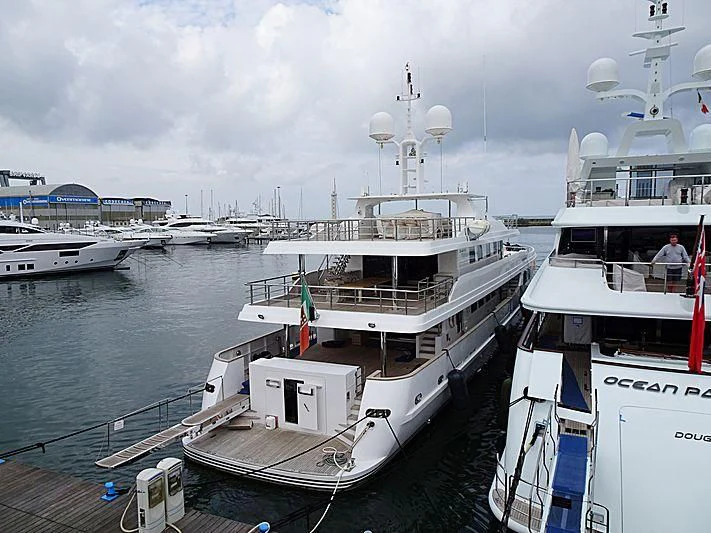 a group of boats are parked in a harbor aboard R23 Yacht for Charter