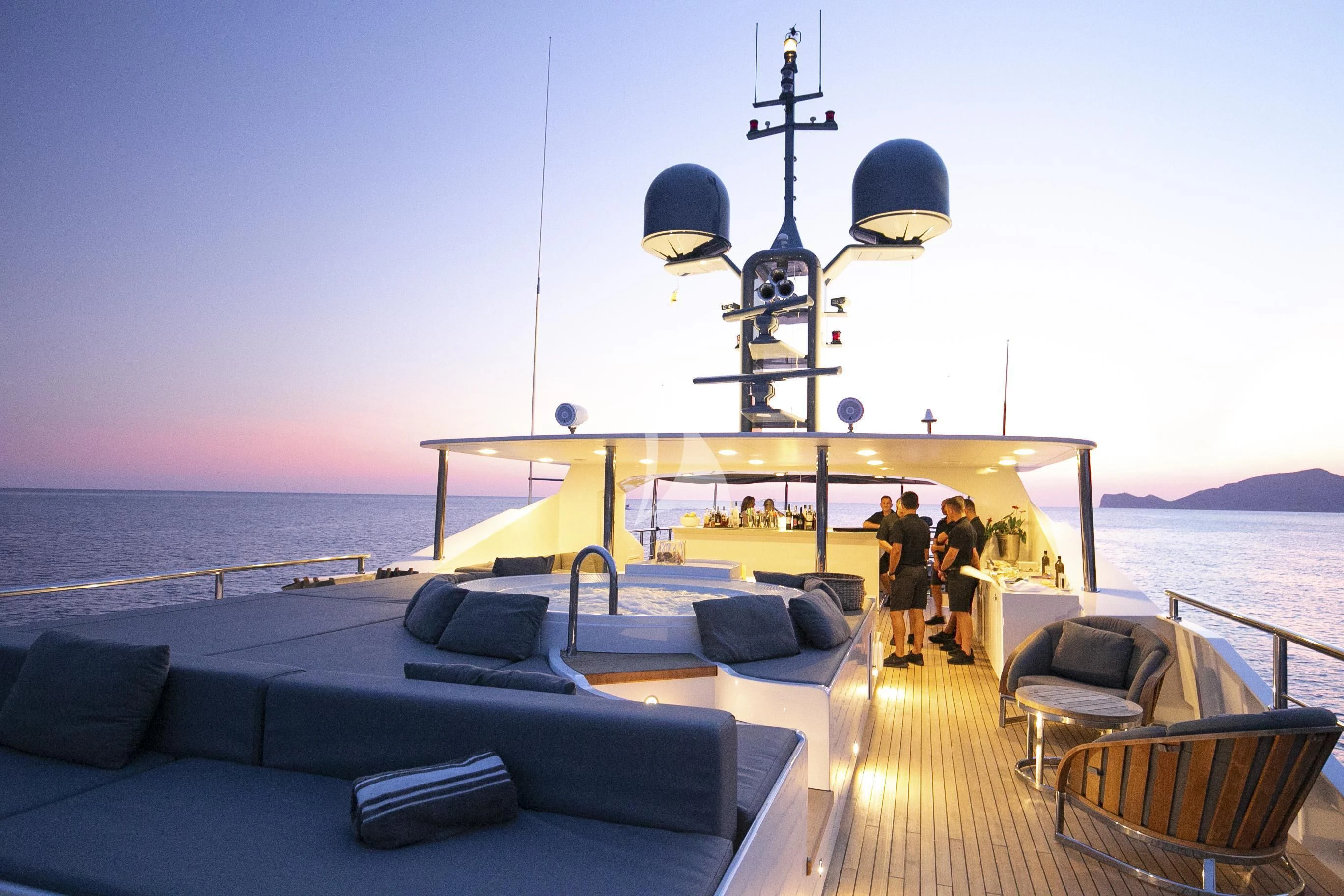 a couple of people walking on a dock on a boat aboard R23 Yacht for Charter