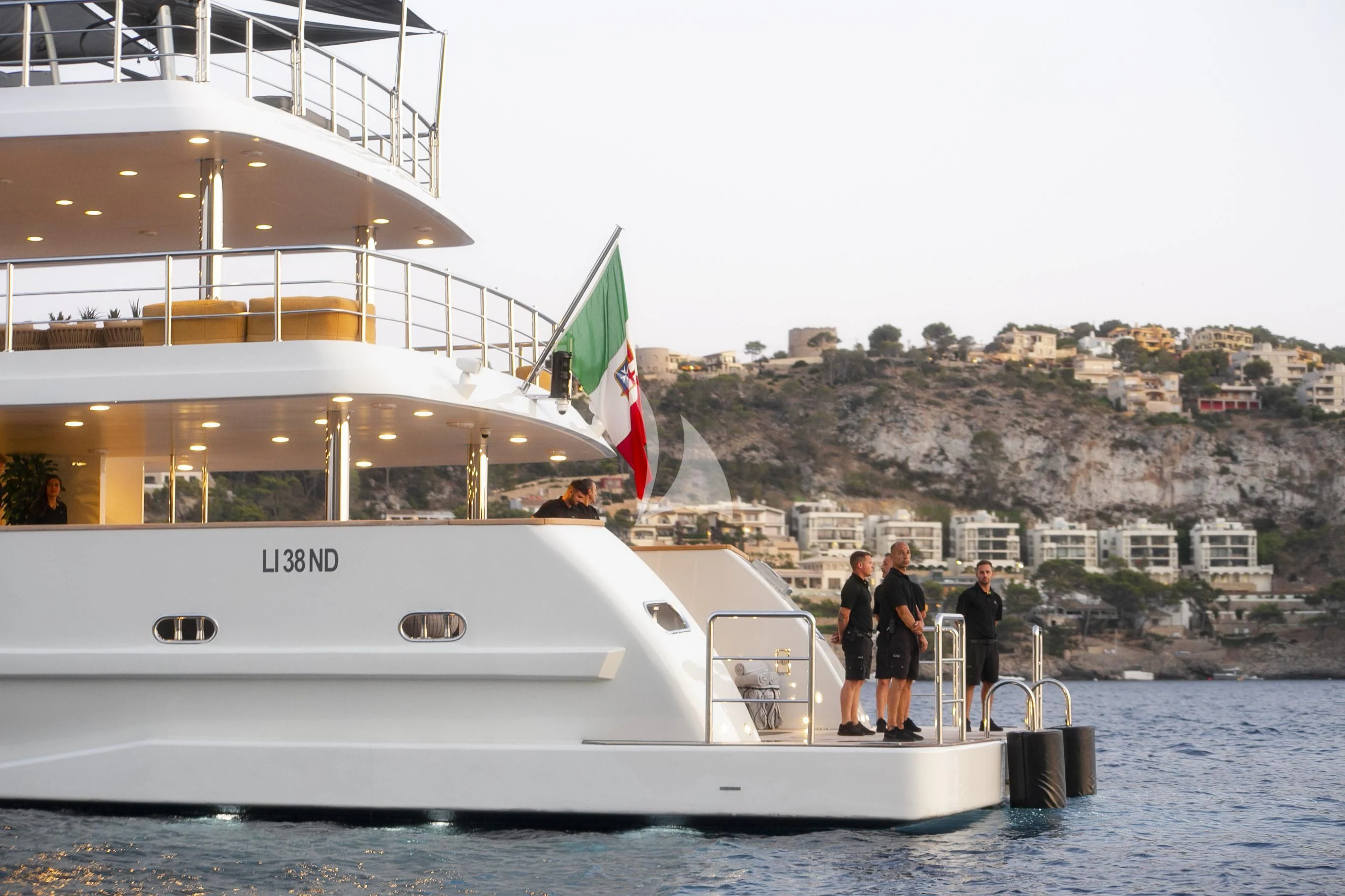 a group of people standing on a boat aboard R23 Yacht for Charter