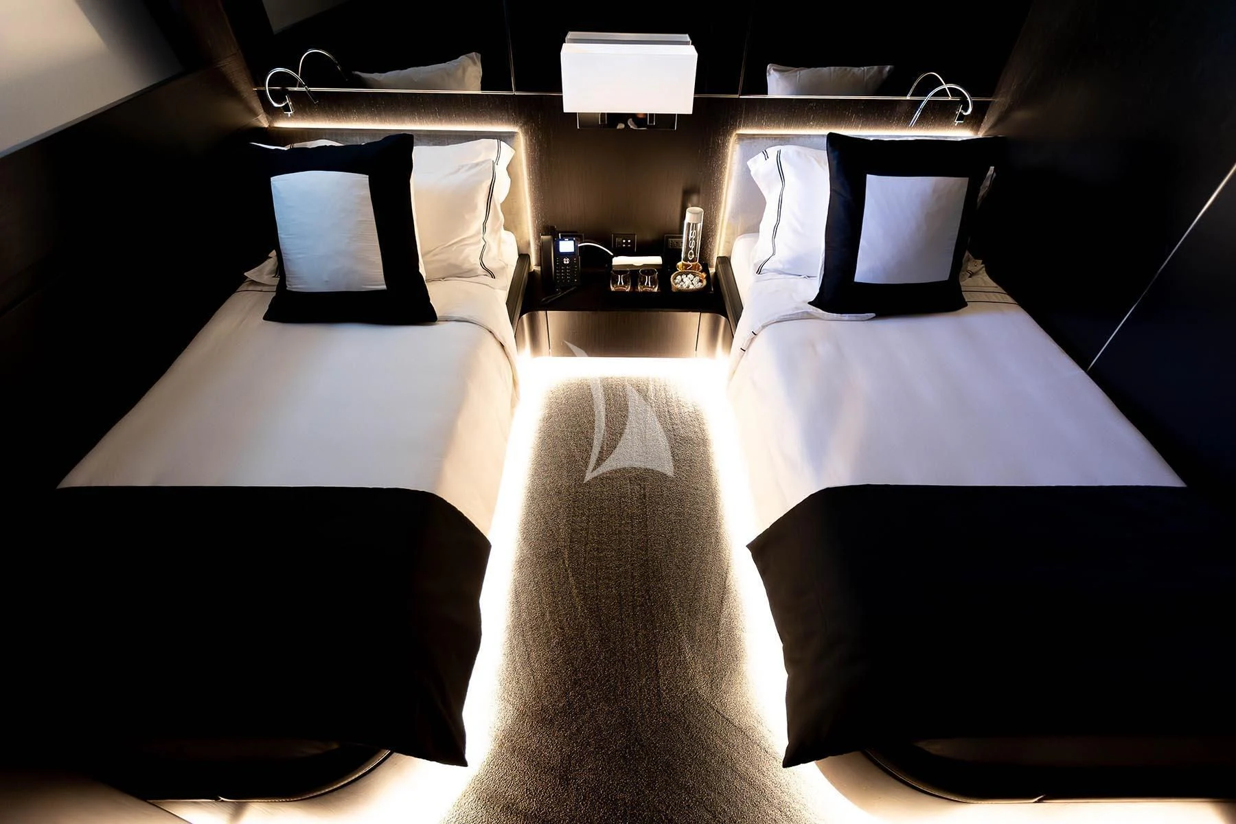 a couple of beds in a room aboard R23 Yacht for Charter