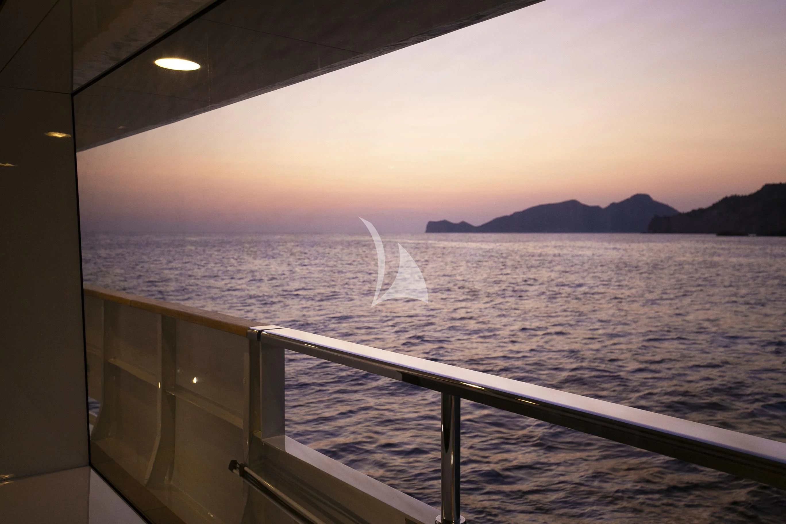 a body of water with a large wave crashing into it aboard R23 Yacht for Charter