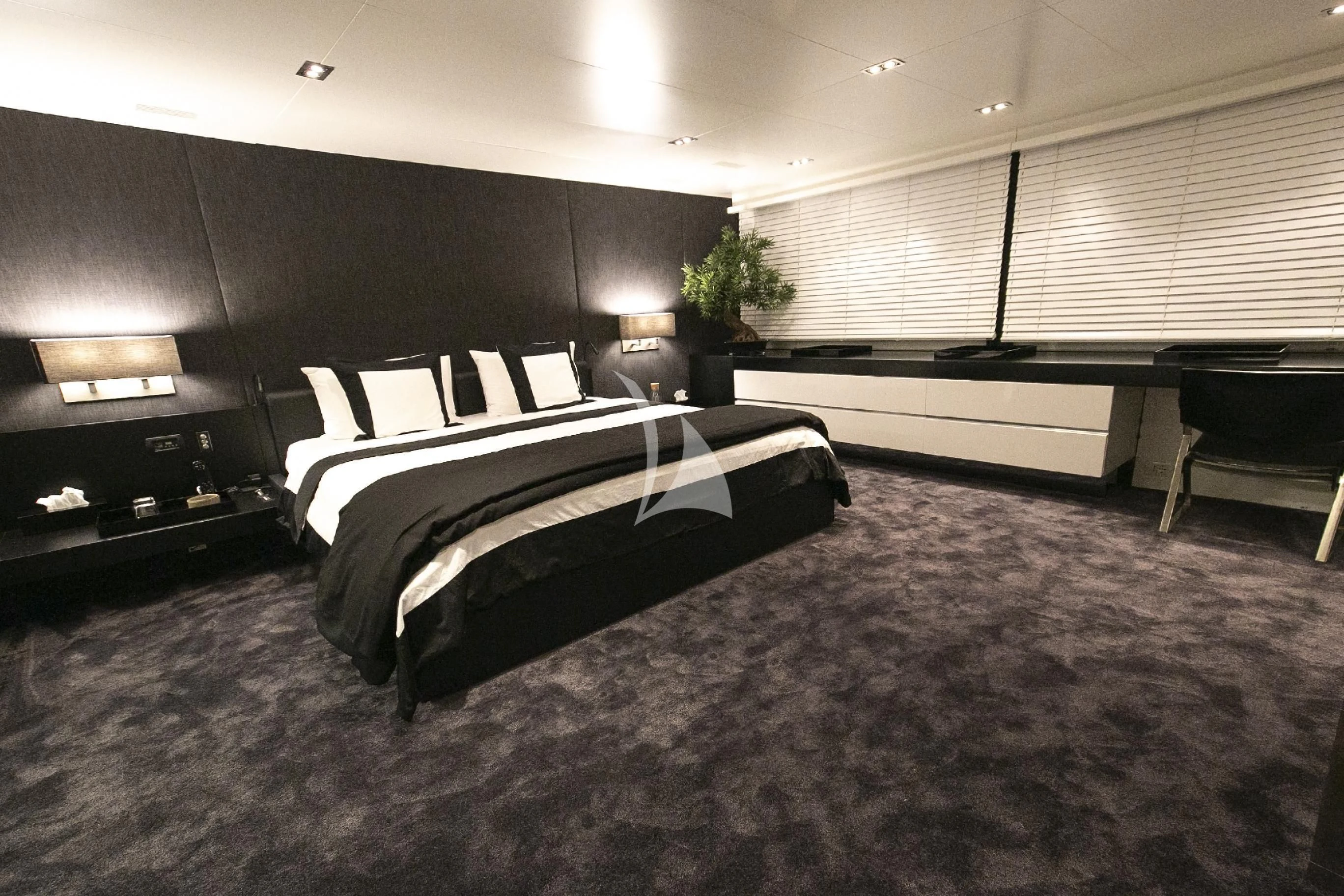 a large bed in a room aboard R23 Yacht for Charter