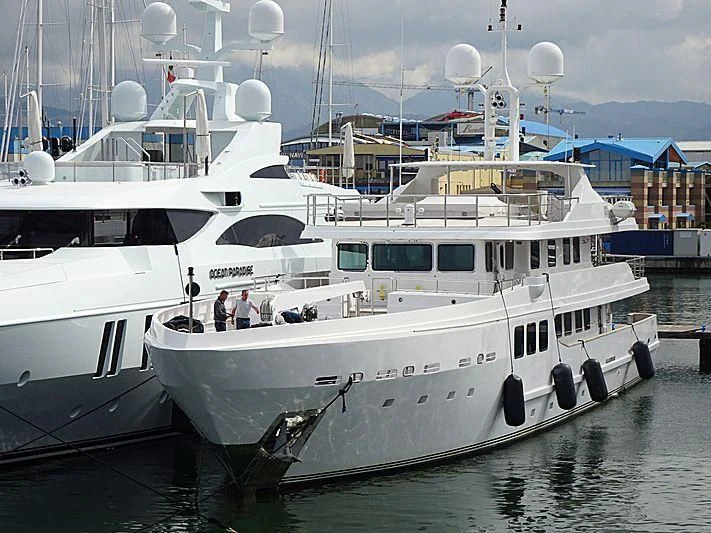 a couple of white yachts aboard R23 Yacht for Charter