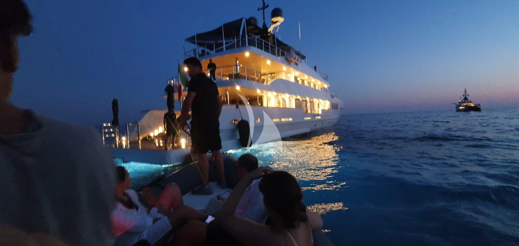 a group of people on a boat aboard R23 Yacht for Charter