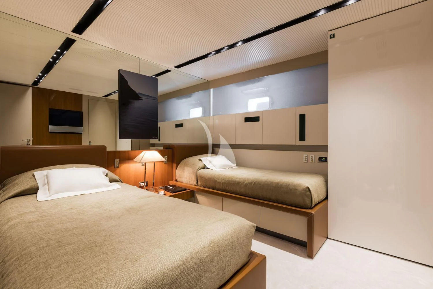 a room with a bed and a couch aboard R23 Yacht for Charter