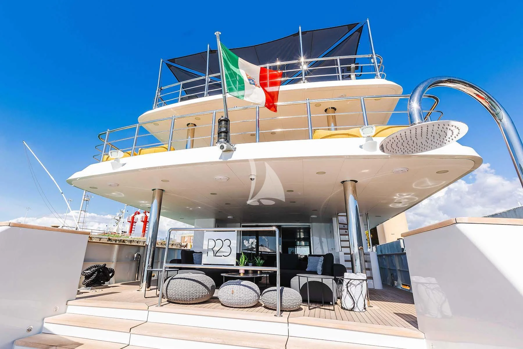 a large white building with a satellite dish on top aboard R23 Yacht for Charter