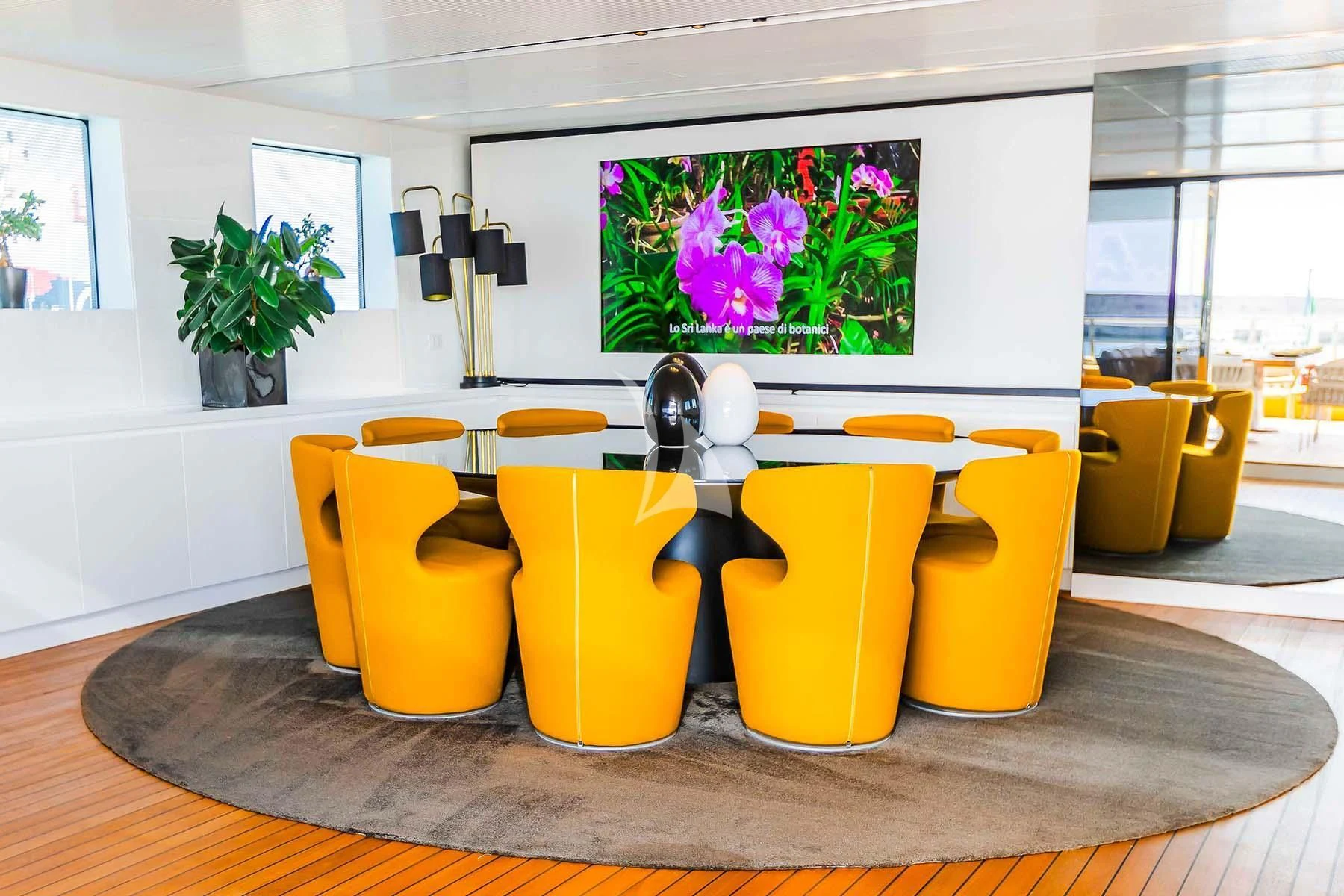 yellow and white chairs in a room aboard R23 Yacht for Charter