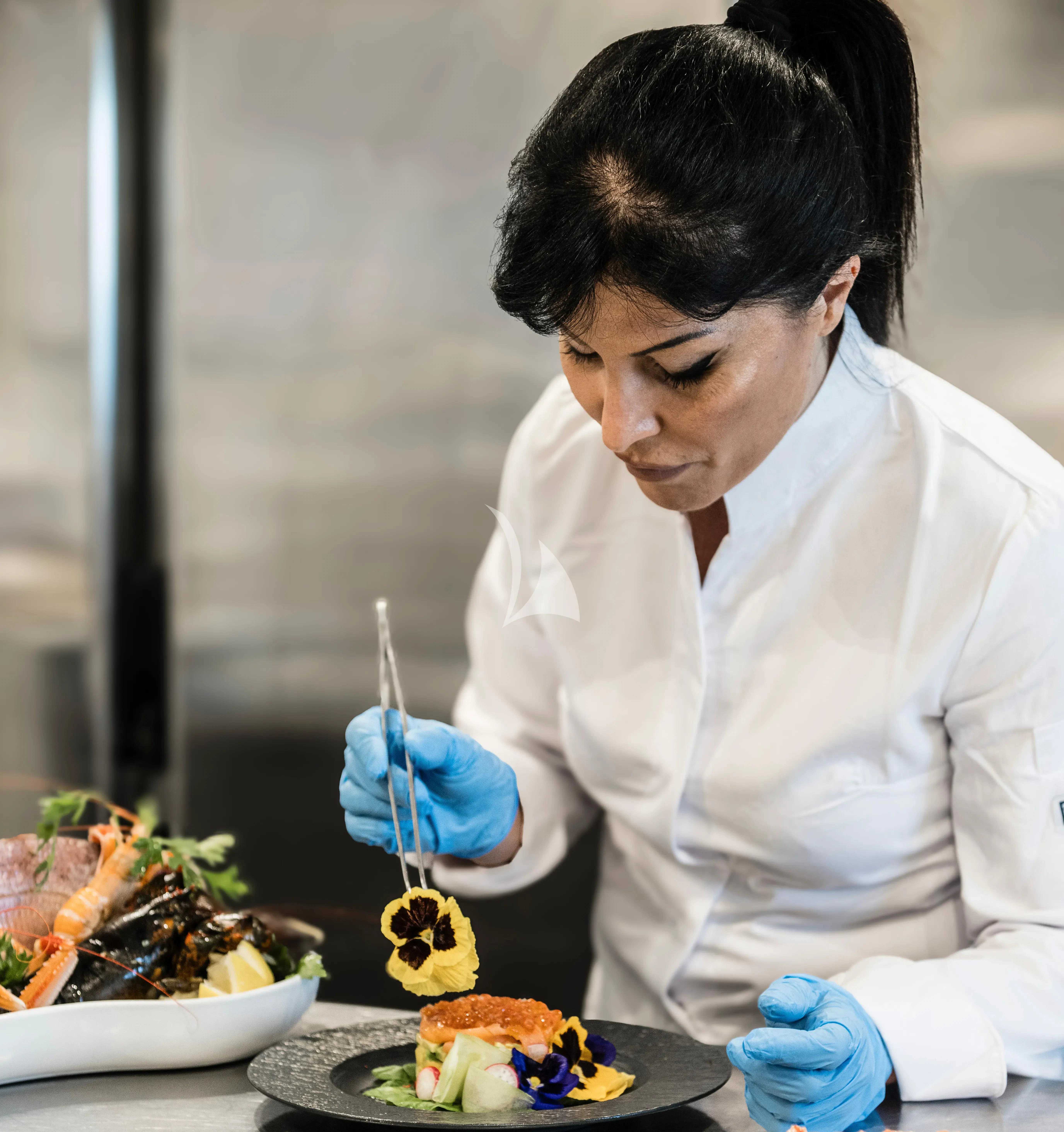 a person in a white lab coat aboard R23 Yacht for Charter