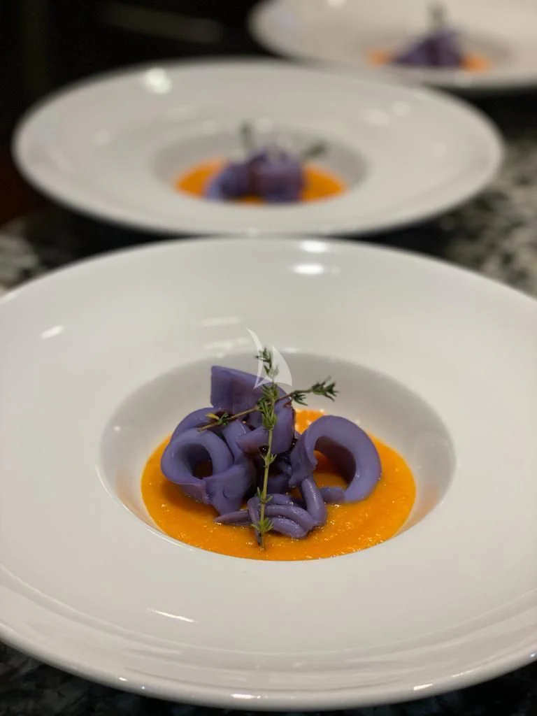 a plate with food on it aboard R23 Yacht for Charter