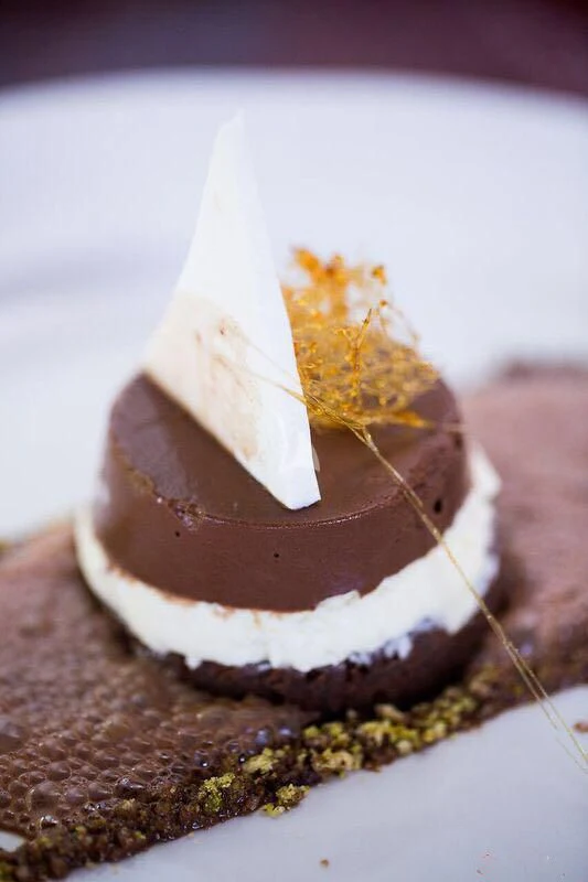 a slice of cake with a fork aboard R23 Yacht for Charter