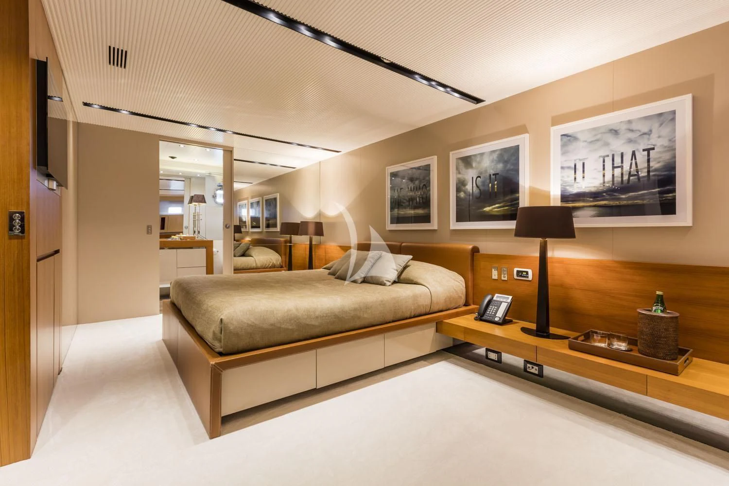 a living room with a couch and a desk aboard R23 Yacht for Charter