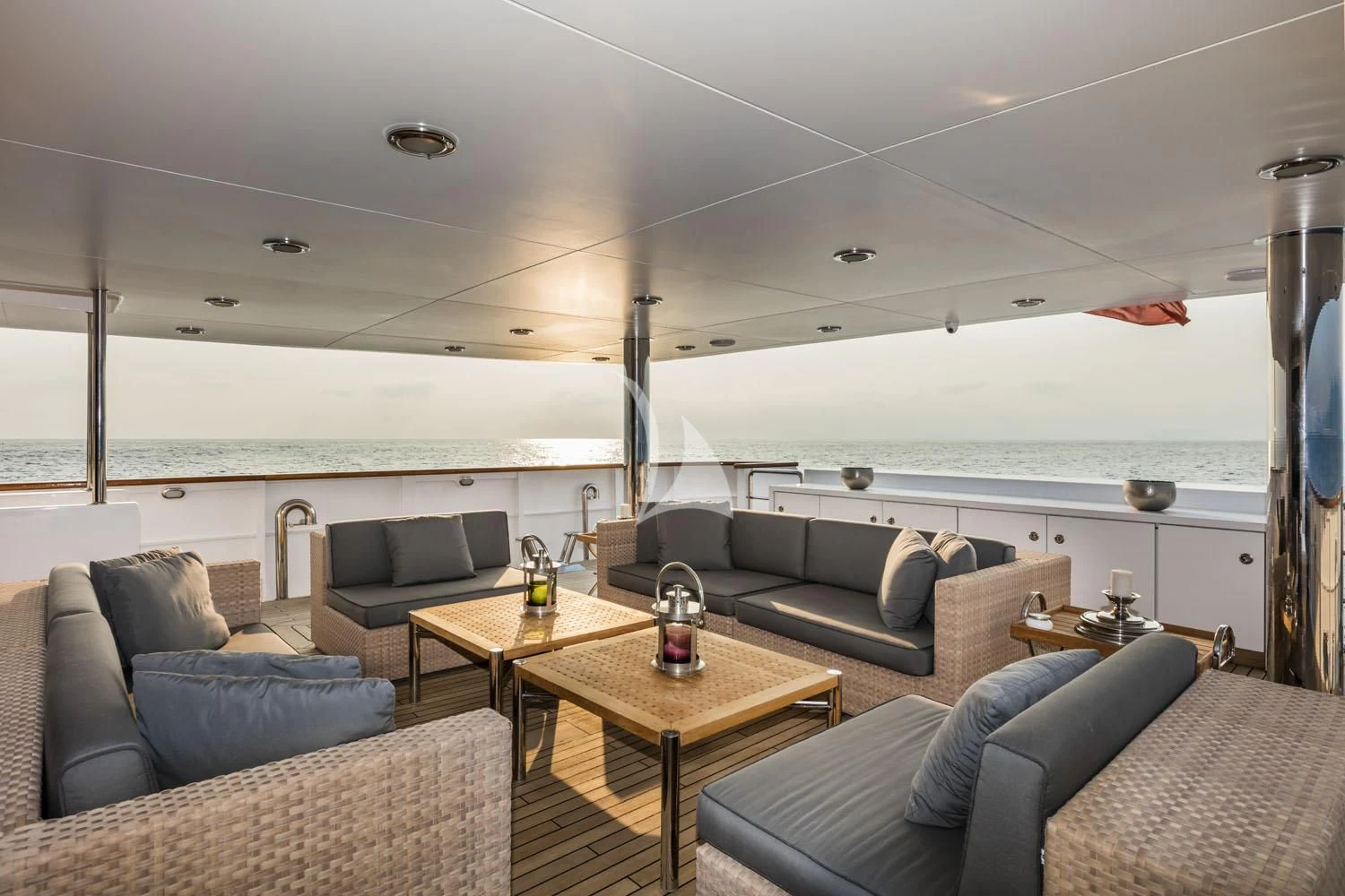a living room with a large window aboard R23 Yacht for Charter