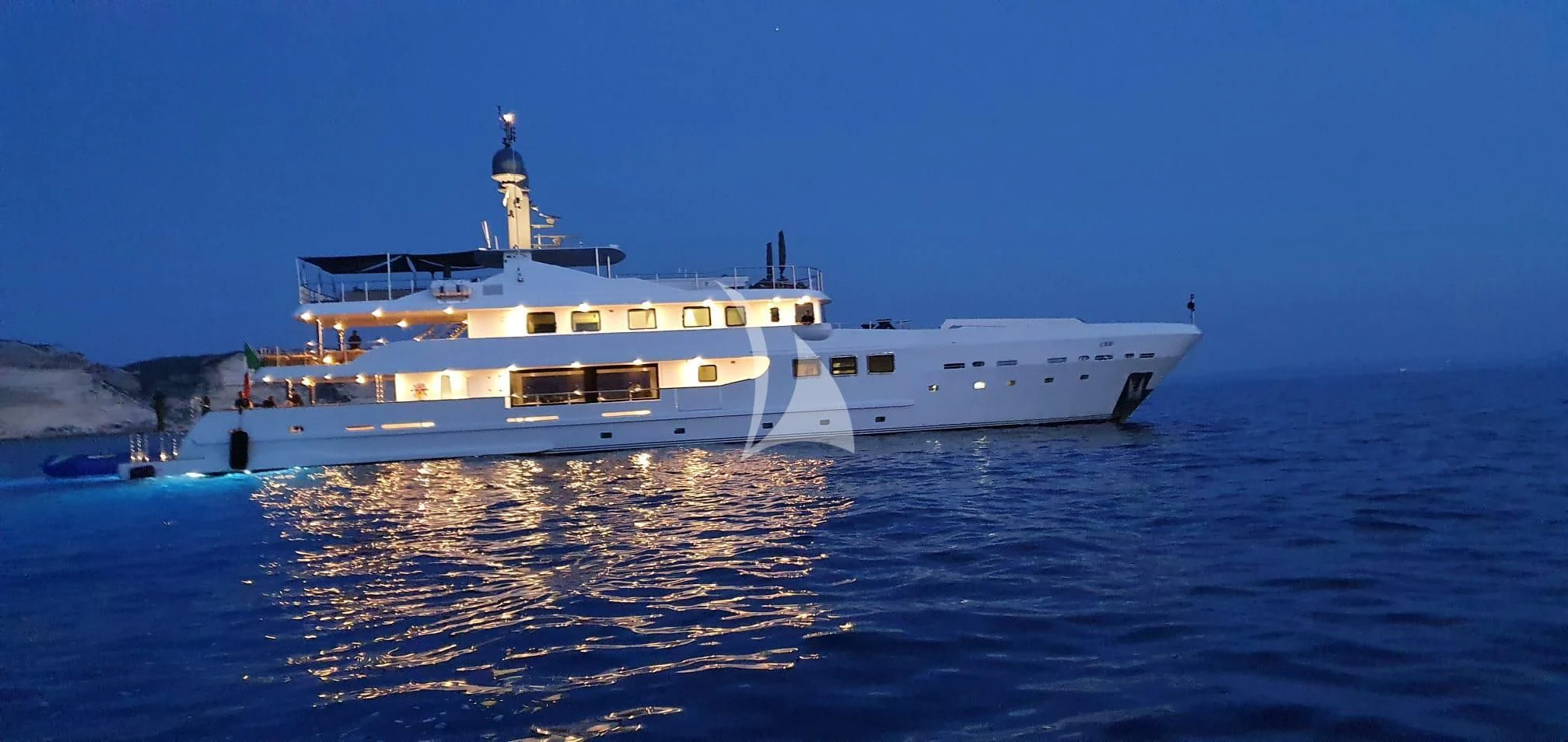 a large white ship in the water aboard R23 Yacht for Charter