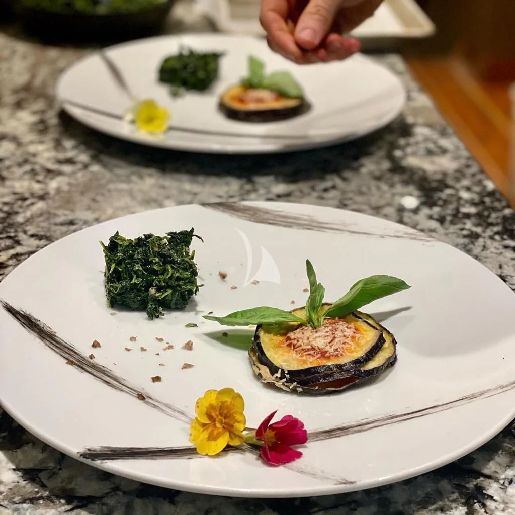 plates of sushi on a table aboard R23 Yacht for Charter