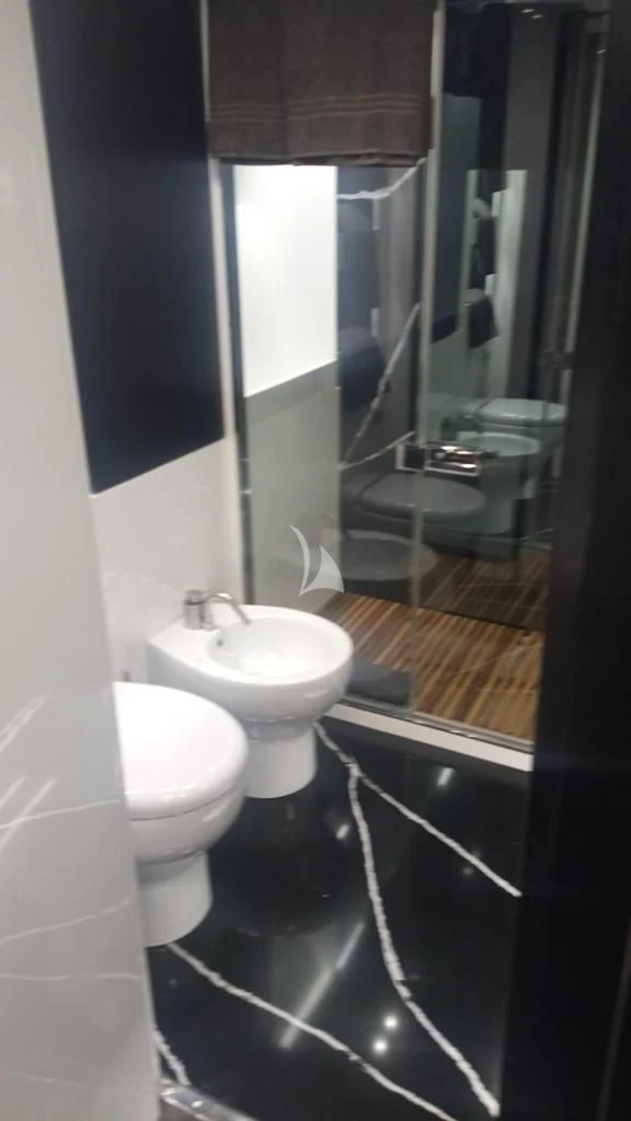 a bathroom with a sink and a toilet aboard R23 Yacht for Charter