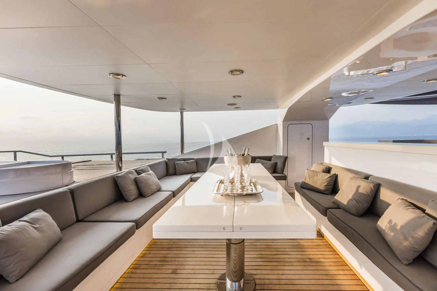 a living room with a large window aboard R23 Yacht for Charter