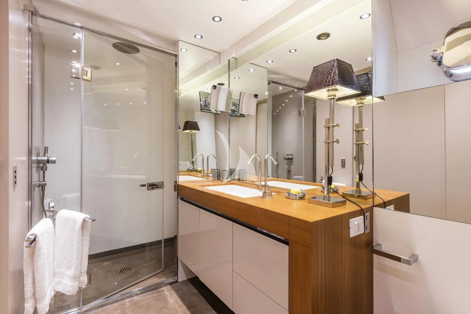 a bathroom with a standup shower aboard R23 Yacht for Charter