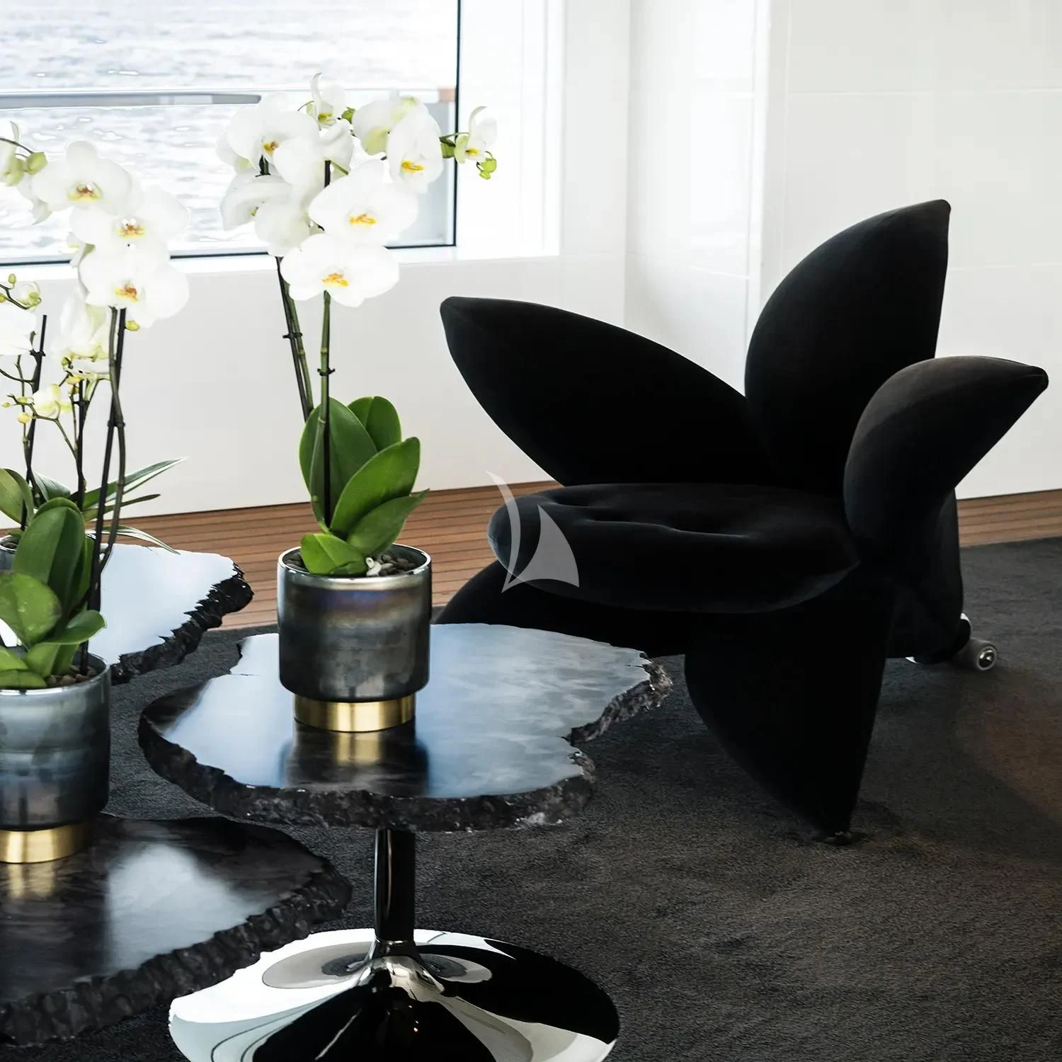 a couple of black chairs with white flowers in a room aboard R23 Yacht for Charter