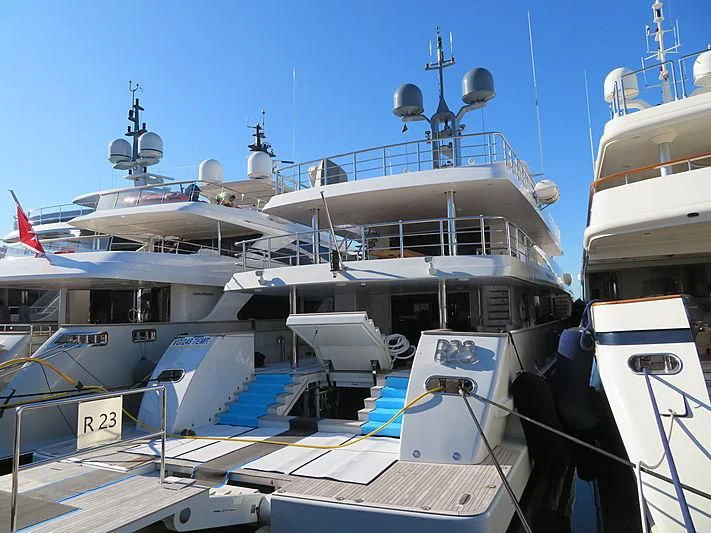 a group of boats are parked at a dock aboard R23 Yacht for Charter