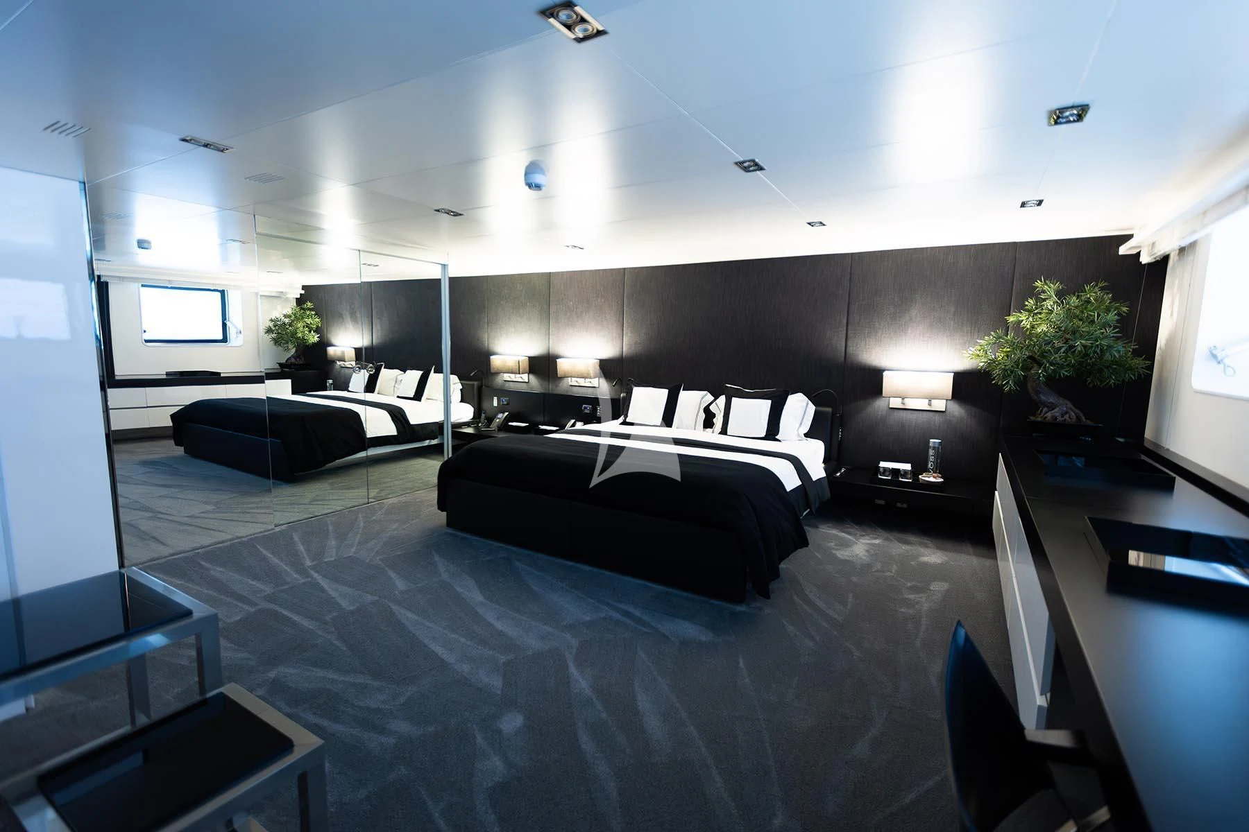 a room with a bed and a couch aboard R23 Yacht for Charter