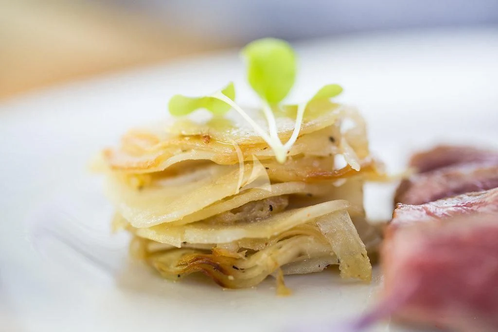 a plate of waffles with a green apple on top aboard R23 Yacht for Charter