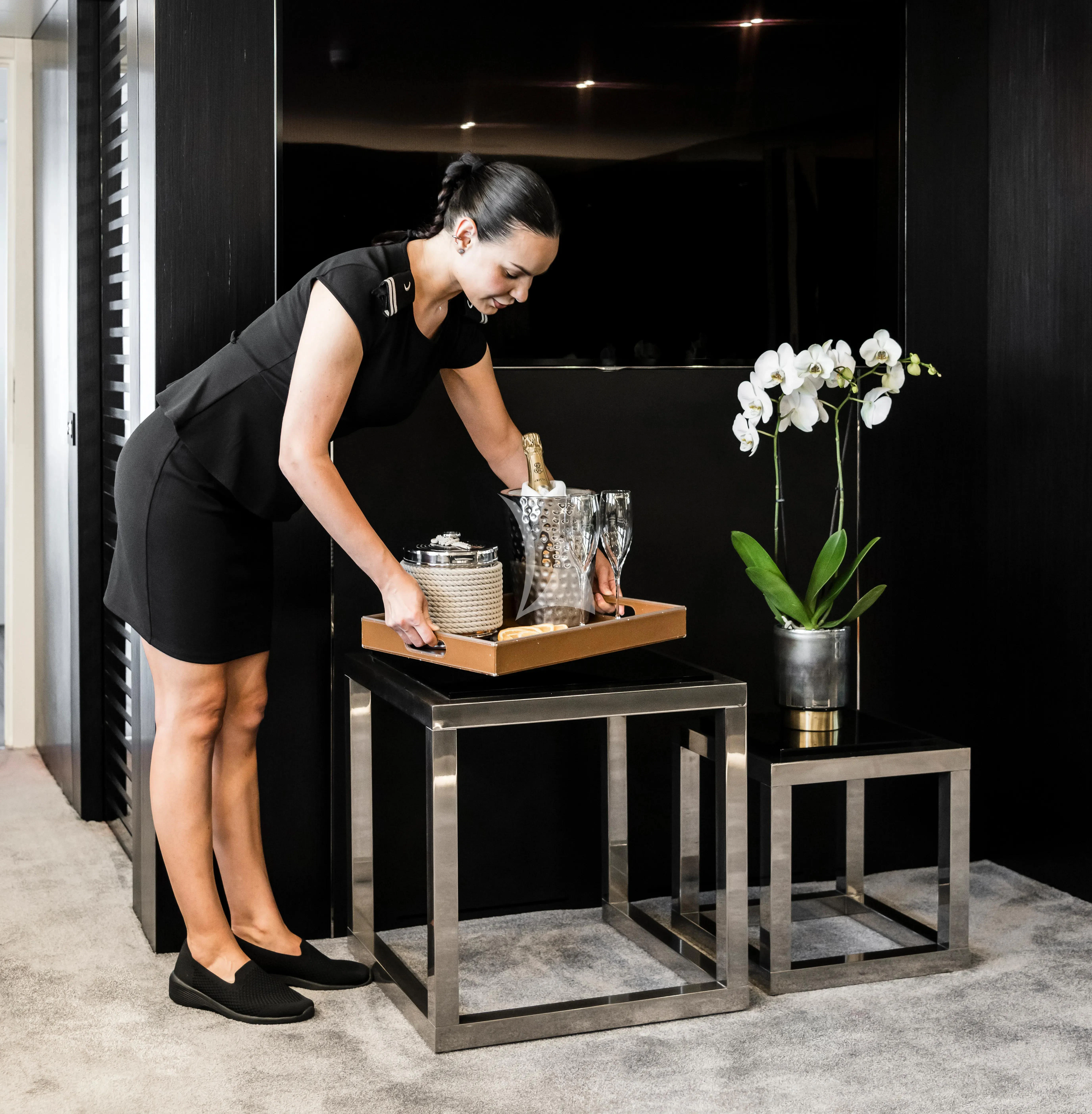 a man cooking on a stove aboard R23 Yacht for Charter