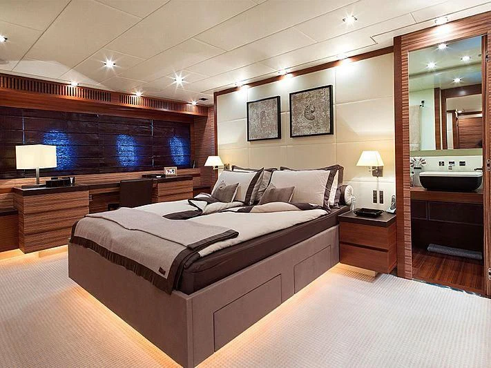 a large bedroom with a large bed aboard ALEON Yacht for Sale