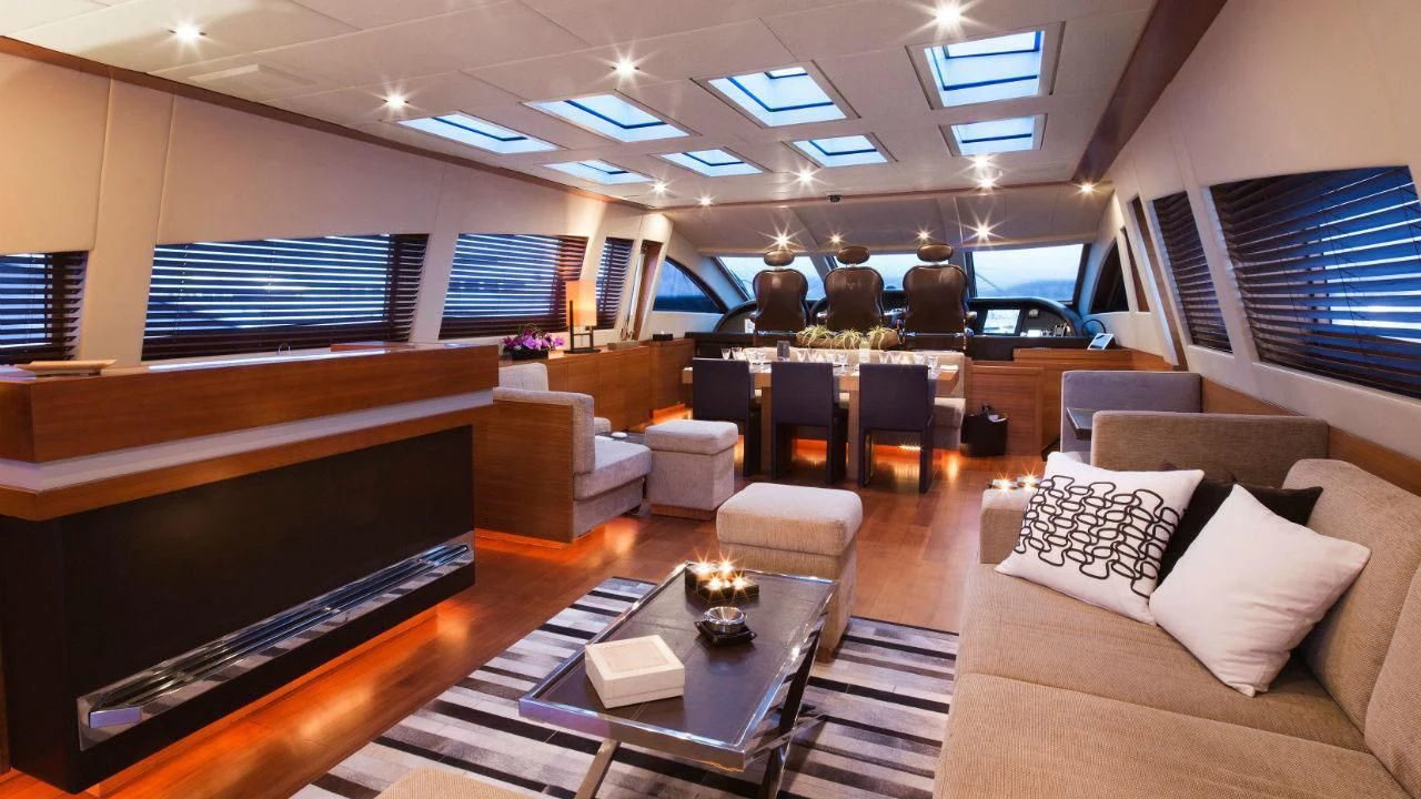 a room with a couch and a table and chairs aboard ALEON Yacht for Sale