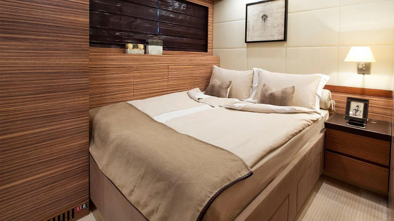 a bed with a white sheet aboard ALEON Yacht for Sale