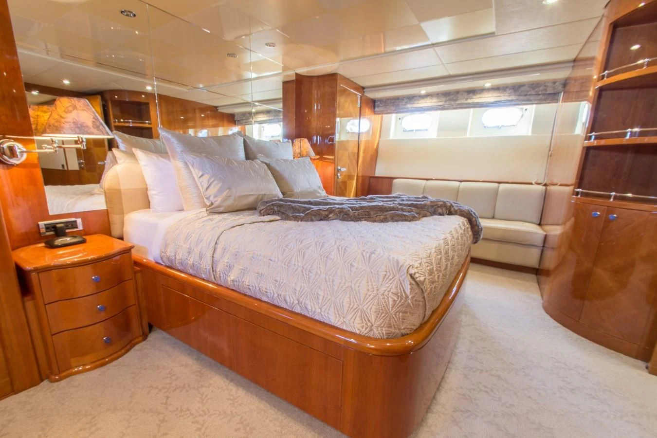 a room with a bed and a dresser aboard NO NAME AZIMUT 100 JUMBO Yacht for Sale