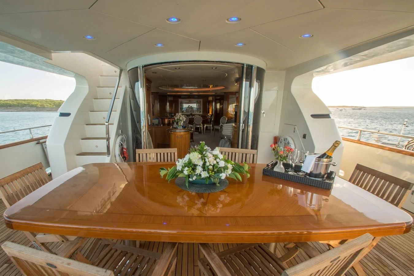 a wooden table with a vase of flowers on it aboard NO NAME AZIMUT 100 JUMBO Yacht for Sale