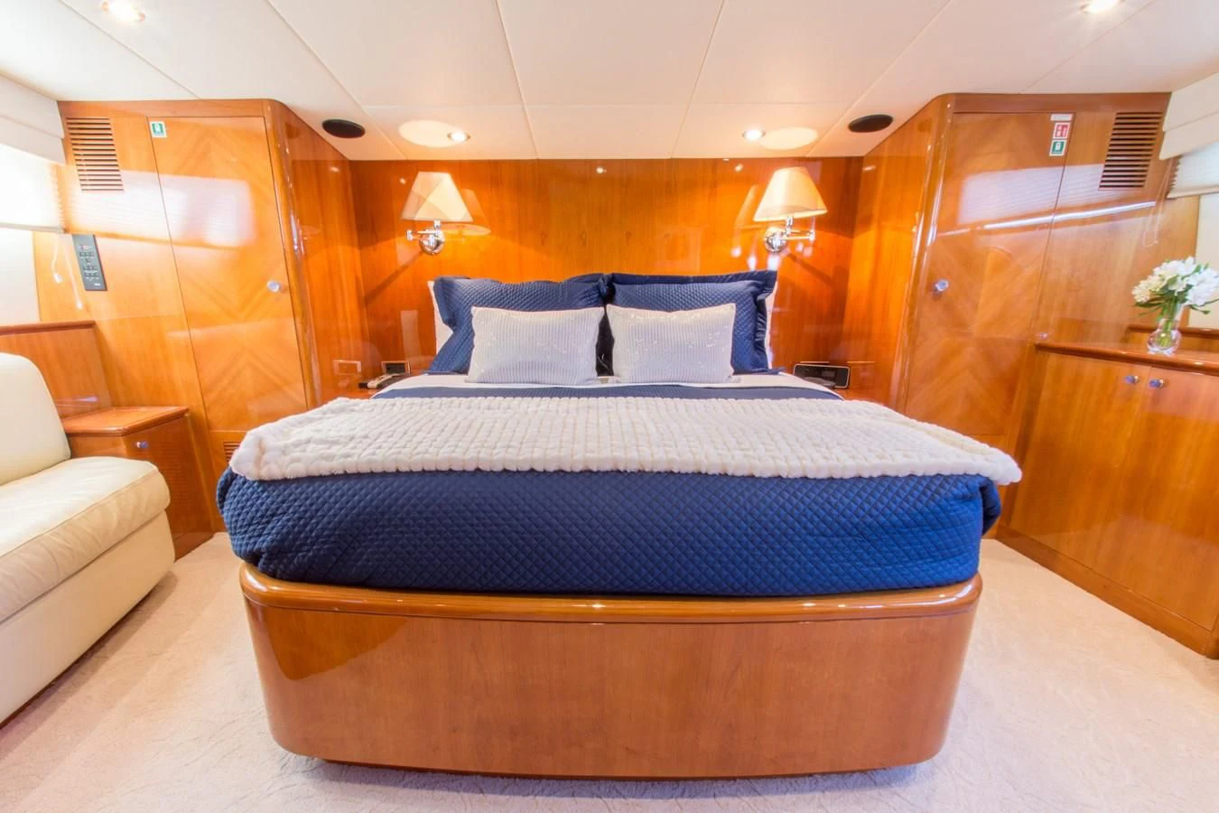 a bed with blue sheets aboard NO NAME AZIMUT 100 JUMBO Yacht for Sale