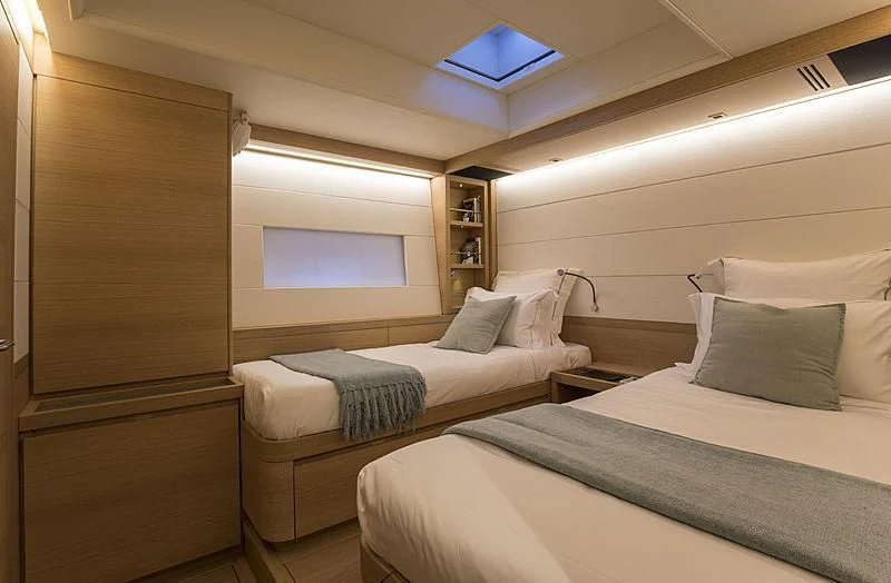 a room with two beds aboard POWER OF 2 Yacht for Sale