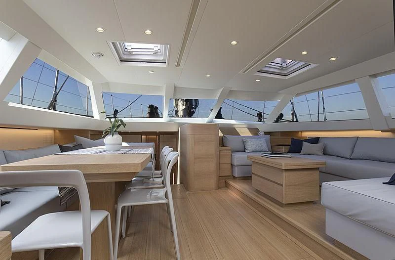 a room with a couch and a table aboard POWER OF 2 Yacht for Sale