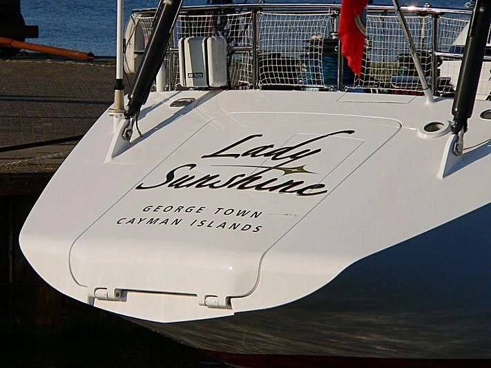a white surfboard on a stand aboard LADY SUNSHINE Yacht for Sale