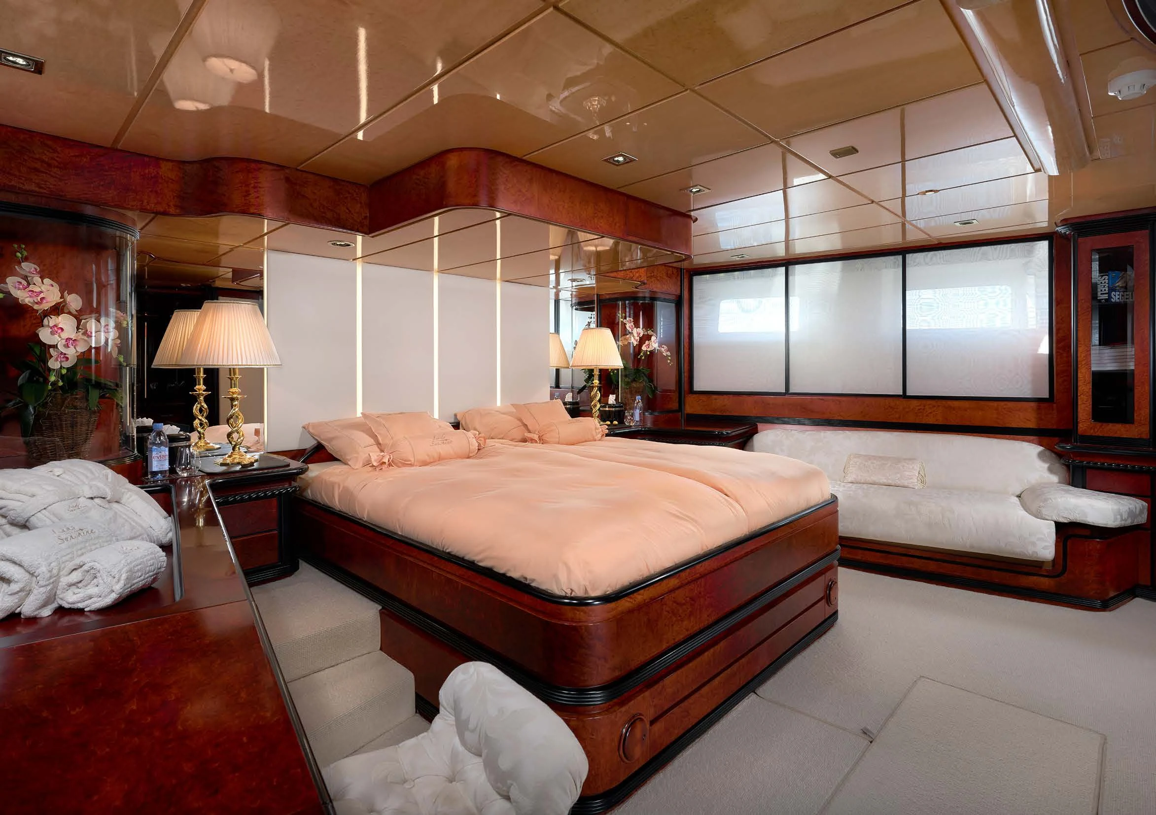 a room with a bed and a large mirror aboard LADY SUNSHINE Yacht for Sale