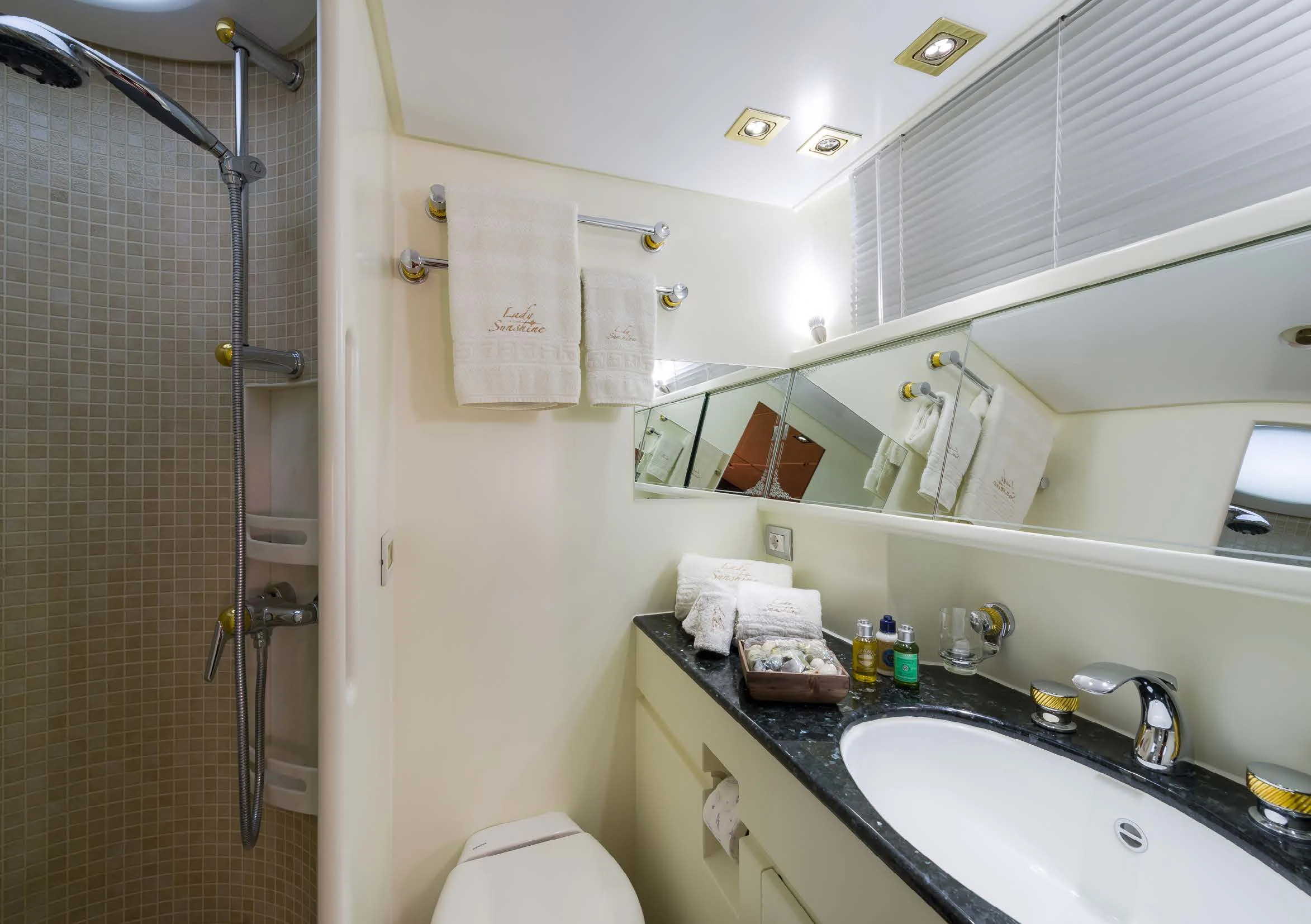 a bathroom with a sink and shower aboard LADY SUNSHINE Yacht for Sale