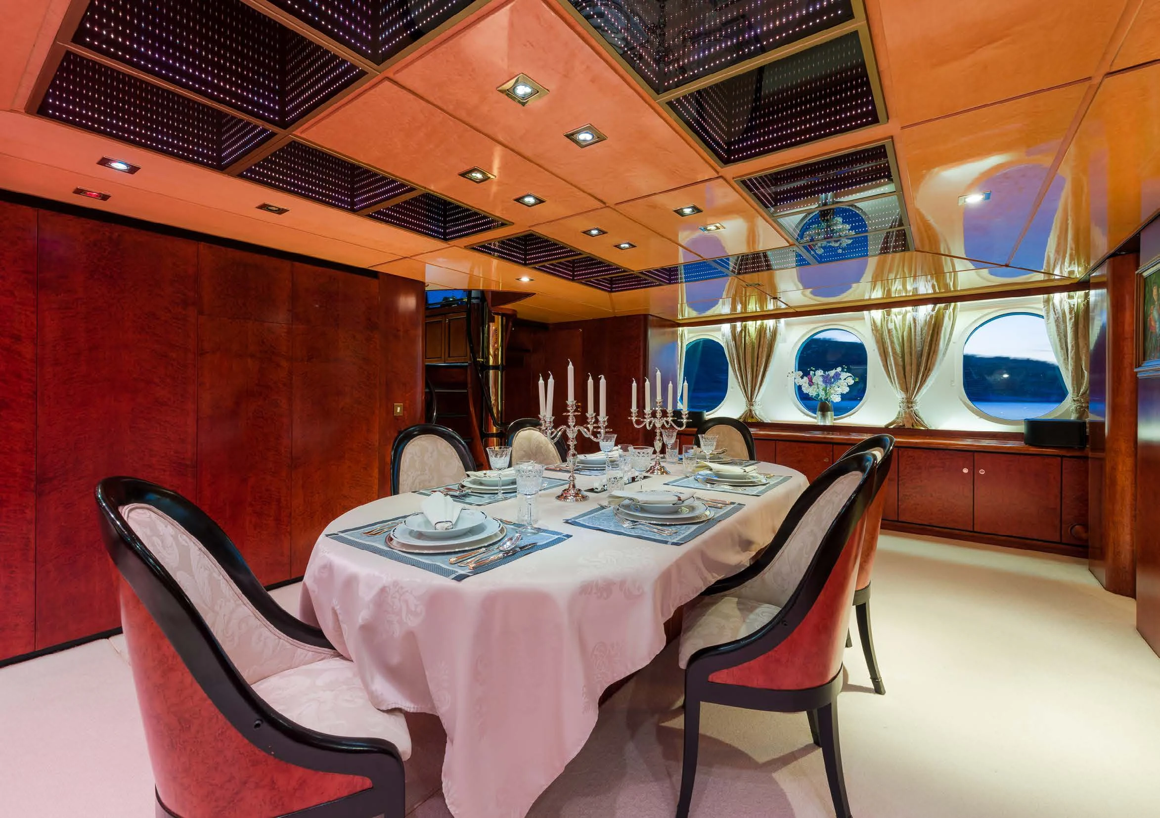 a room with a table and chairs aboard LADY SUNSHINE Yacht for Sale