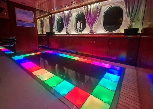 a large room with a tv and a tv aboard LADY SUNSHINE Yacht for Sale