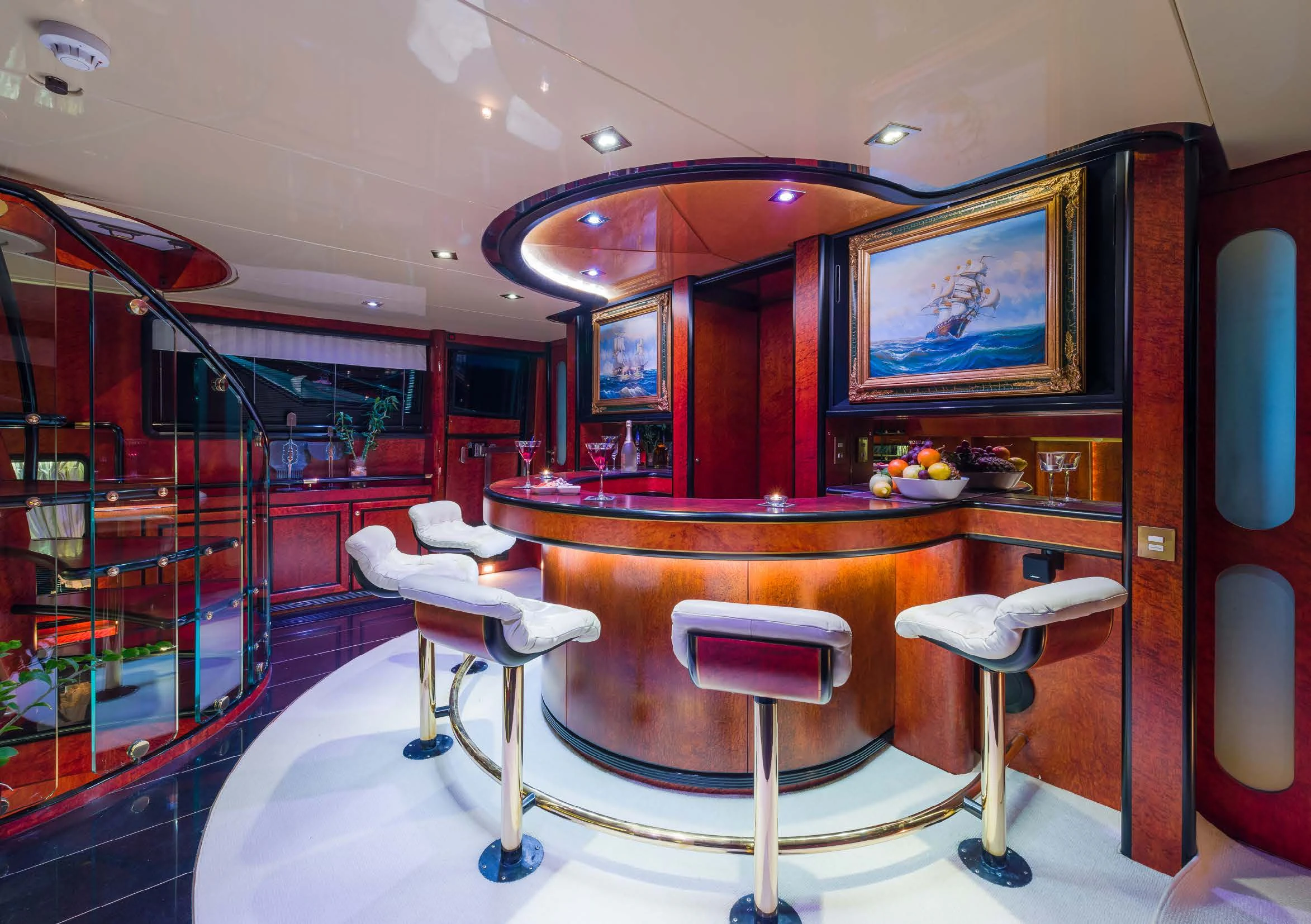 a room with a table chairs and a large mirror aboard LADY SUNSHINE Yacht for Sale
