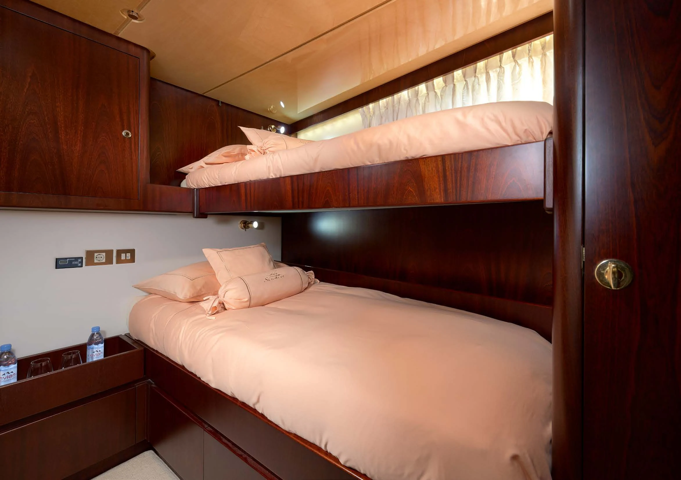 a room with a bed and a wood wall aboard LADY SUNSHINE Yacht for Sale