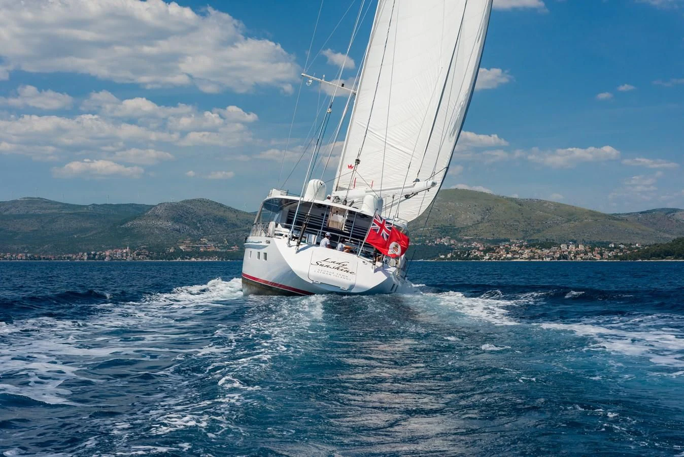 a boat sailing on the water aboard LADY SUNSHINE Yacht for Sale