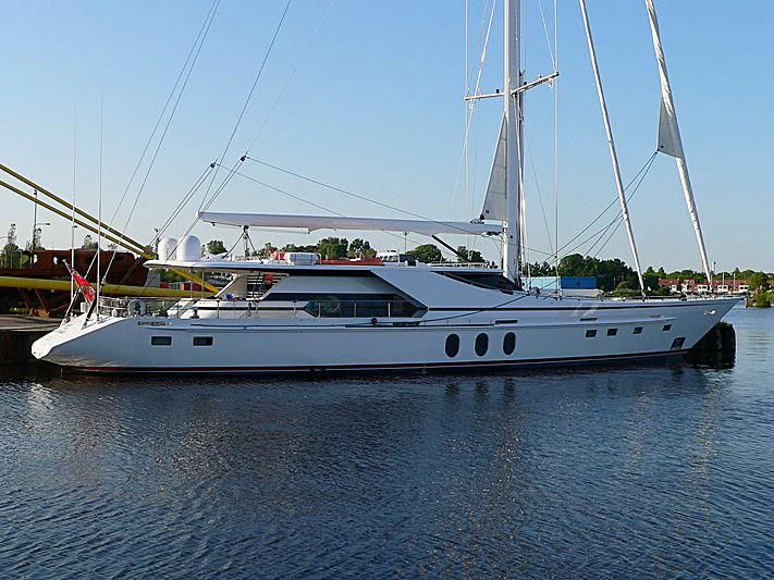 a white yacht in a harbor aboard LADY SUNSHINE Yacht for Sale