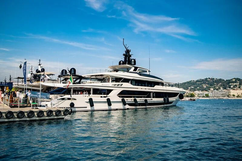 a couple of boats on the water aboard INFINITY Yacht for Sale